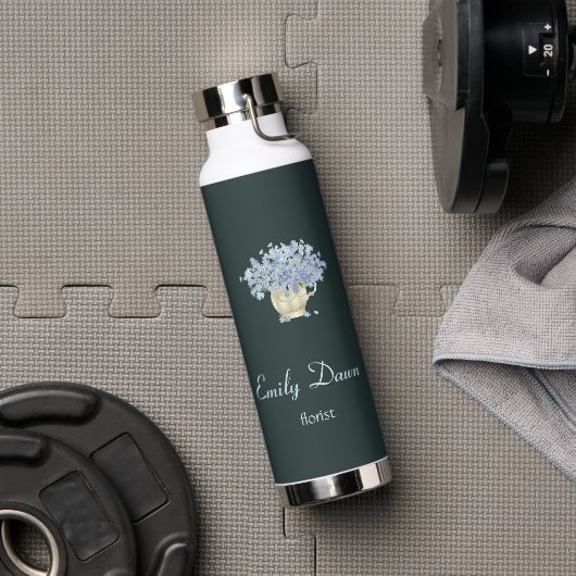 Blauwe bloemen in vasgrijs waterfles (Gym)