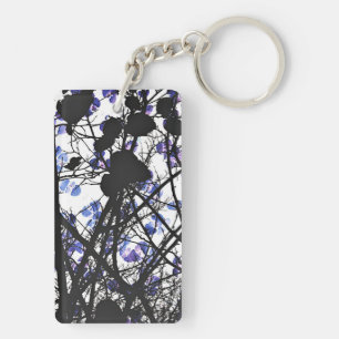 Blauwe bloemen op het concept van de winterboom di sleutelhanger