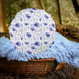 Blauwe bloemen over print kussen