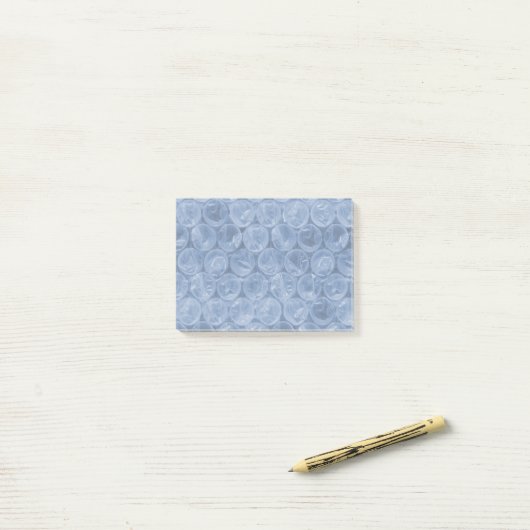Blauwe bubbelomhulsel post-it® notes (Op bureau)