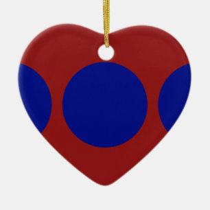 Blauwe cirkels op rood keramisch ornament