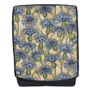 Blauwe cornbloemen, wilde bloemen op honnegeel rugtassen