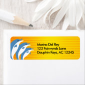 Blauwe dolfijnen dansen in de tropische zon etiket (Insitu)