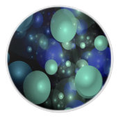 Blauwe en Groene Bubbels Over Zwart Keramische Knop (Voorkant)