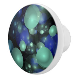 Blauwe en Groene Bubbels Over Zwart Keramische Knop