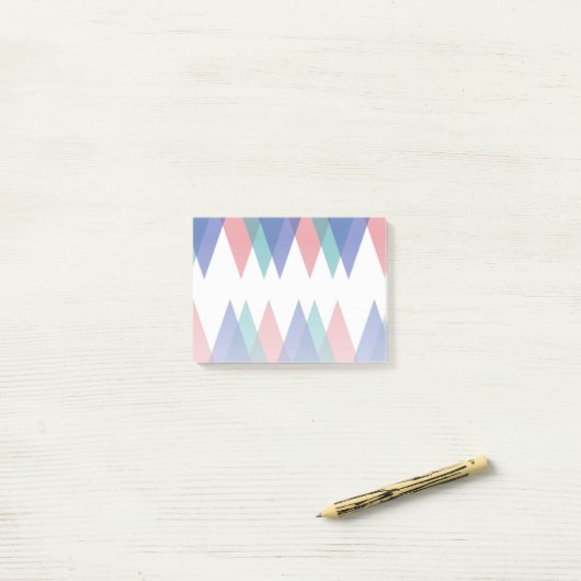 Blauwe en koraaldriehoeken post-it® notes (Op bureau)