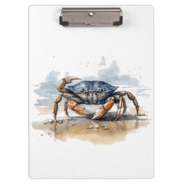blauwe en oranje krab die op het strand loopt klembord