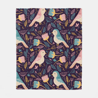 Blauwe en roze vogels met bloemen en bladeren op d fleece deken