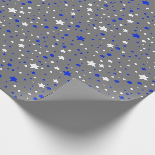 Blauwe en witte sterren op grijs cadeaupapier (Hoek)