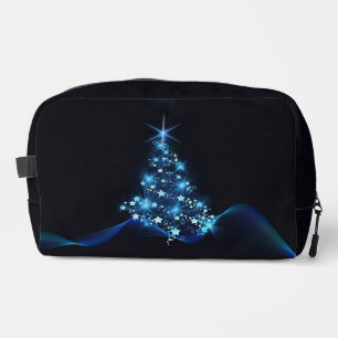 Blauwe glans van sterren op donkere kerstboom toilettasje