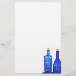 Blauwe glazen flessen briefpapier