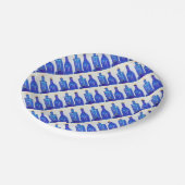 Blauwe glazen flessen papieren bordje (Gekanteld)