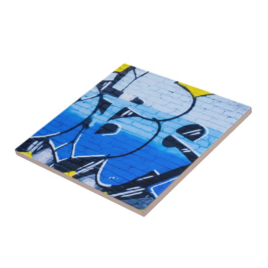 Blauwe graffiti op een muur tegeltje (Zijkant)