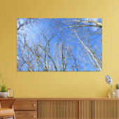 Blauwe hemel, bomen in de winter canvas afdruk (Insitu (Woonkamer))