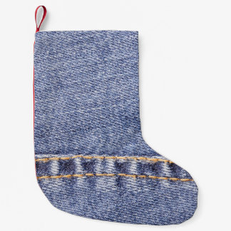 Blauwe jeans: gedetailleerde naaitextuur. kleine kerstsok