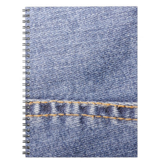 Blauwe jeans: gedetailleerde naaitextuur. notitieboek