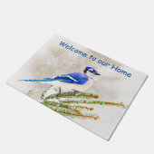 Blauwe kap in een dennenboom met sneeuw deurmat (Schuin)