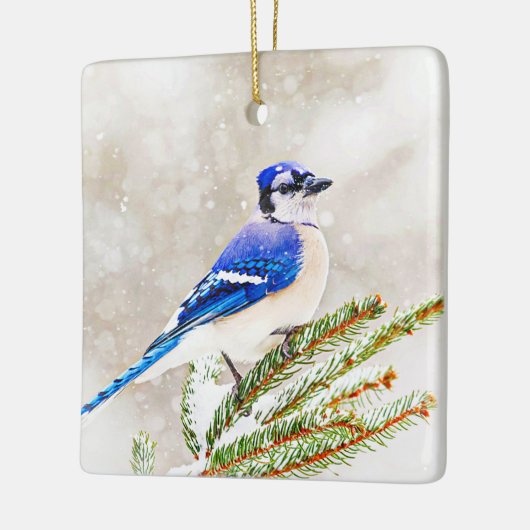 Blauwe kap in een dennenboom met sneeuw keramisch ornament (Links)