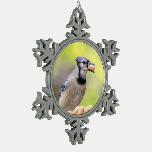 Blauwe kap met pinda's tin sneeuwvlok ornament (Links)