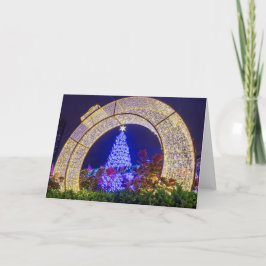 Blauwe kerstboom omlijst in een kerstbal kaart