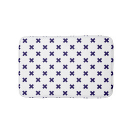 Blauwe marineschijven op witte badmat