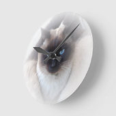 Blauwe ogen siamese kat ronde klok (Hoek)