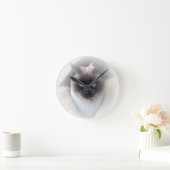 Blauwe ogen siamese kat ronde klok (Huis)