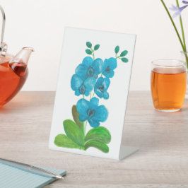 Blauwe orchidee reclamebord met voetstuk