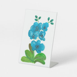 Blauwe orchidee reclamebord met voetstuk