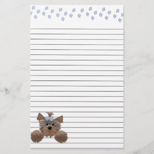 Blauwe puppy- en blauw-schilderafdrukken gelijnd briefpapier