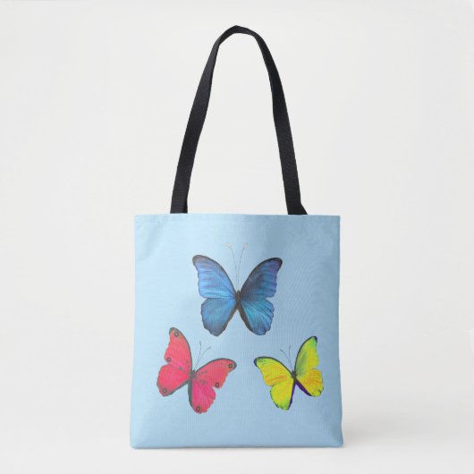Blauwe rode en gele vlinders op lichtblauw tote bag (Voorkant)