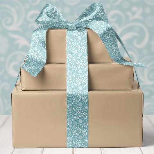 Blauwe sneeuwvlokken en kerstswirls satijnen lint