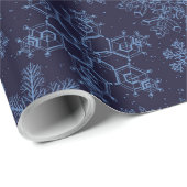 Blauwe sneeuwvlokken op blauw cadeaupapier (Rol Hoek)