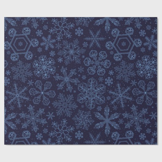 Blauwe sneeuwvlokken op blauw cadeaupapier (Vlak)