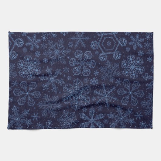 Blauwe sneeuwvlokken op blauw theedoek (Horizontaal)