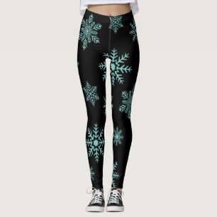 Blauwe sneeuwvlokken op zwarte Leggings