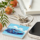 Blauwe sportauto onder heldere lucht sleutelhanger (Voorkant Rechts)