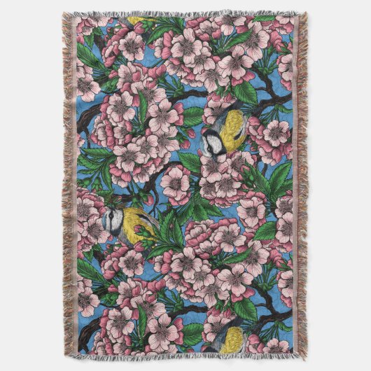 Blauwe stietvogels in de bloeiende kersenboom op b deken (Voorkant Verticaal)