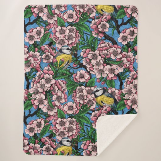 Blauwe stietvogels in de bloeiende kersenboom op b sherpa deken (Voorkant)