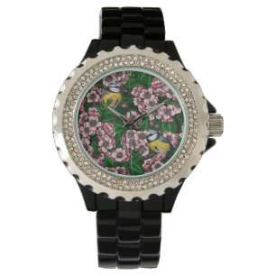 Blauwe stietvogels in de bloeiende kersenboom op g horloge