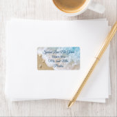 Blauwe strandgolven verspreiden liefde hand ontsme etiket (Insitu)