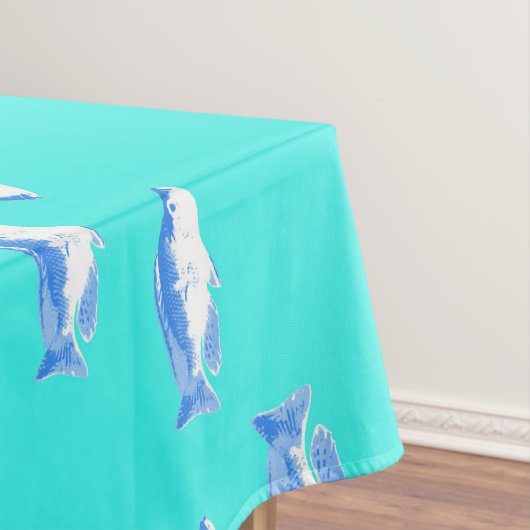 Blauwe vis op turquoise tafelkleed (Voorbeeld)