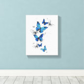 Blauwe Vliegende Vlinders Morpho Canvas Afdruk (Insitu (Houten vloer))