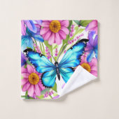 Blauwe vlinder in een gebied met bloemen bad handdoek (Wasdoekje)