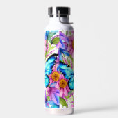 Blauwe vlinder in een gebied met bloemen waterfles (Links)