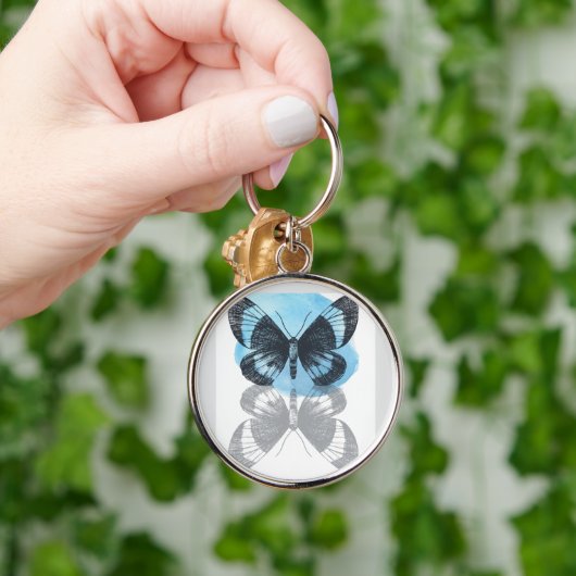 Blauwe vlinder magie. sleutelhanger (Hand)