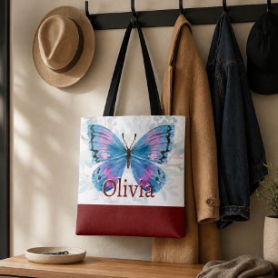 Blauwe vlinder met bordeauxrode accenten tote bag