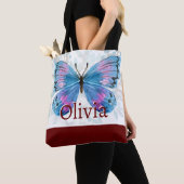 Blauwe vlinder met Bourgondische accenten Tote Bag (Dichtbij)