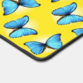 Blauwe vlinders patroon op geel bureaumat (Hoek)
