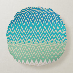 Blauwgroen blauw, turquoise en groene zigzags rond kussen